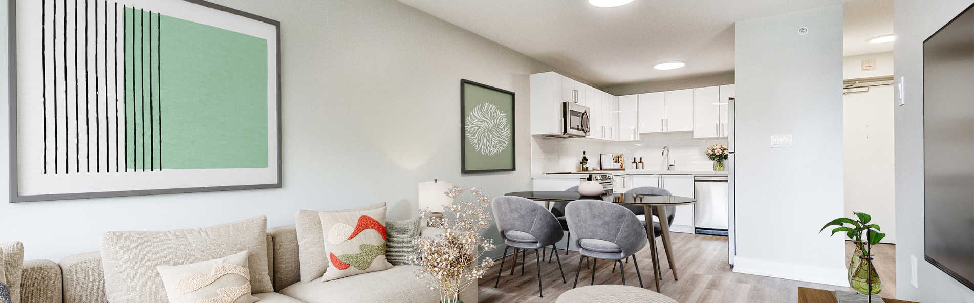 Living room and kitchen of apartment in Meadowvale. Elora by Minto Apartments.